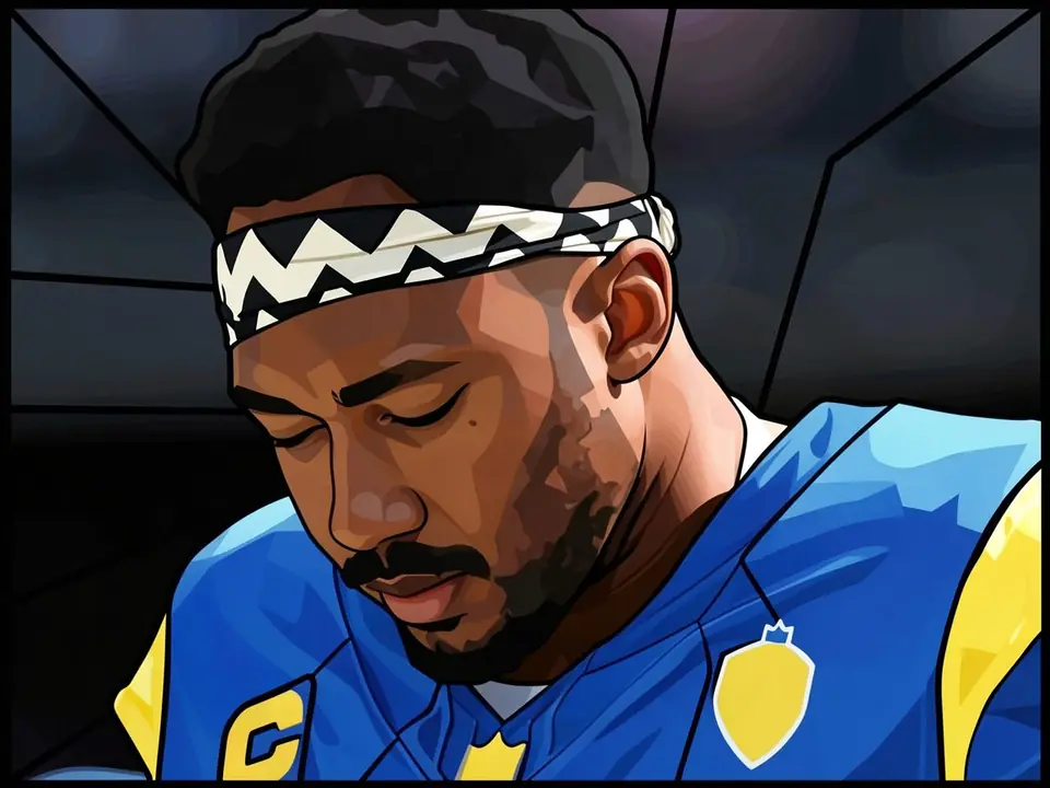 Myles Garrett in Rams-Blau und Gelb mit Stirnband, blickt ernst nach unten