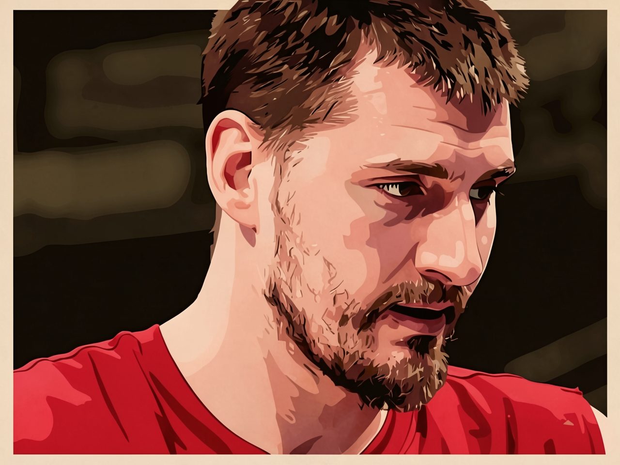 Close-up of a basketball player in a red jersey looking down.