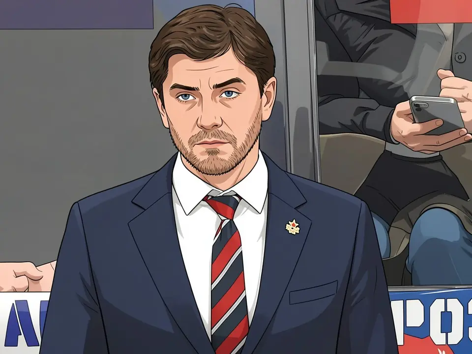 CSKA-Trainer Igor Nikitin in blauem Anzug und rot-blauem Krawatt auf der Bank.