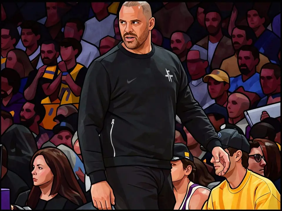 Ime Udoka in a black tracksuit at Rockets media day, player in yellow shirt beside him.