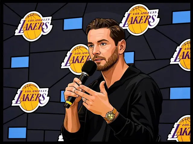 J.J. Redik speaks at a Lakers press conference in front of a logo backdrop.