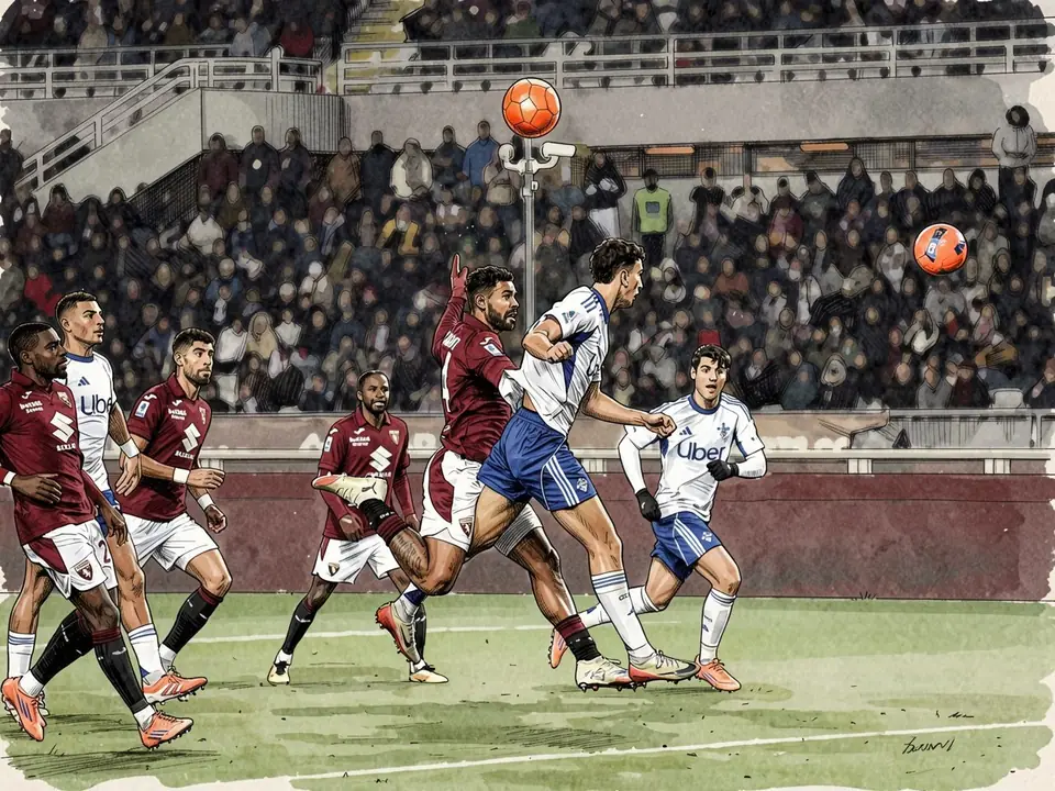 Torino players in maroon kits compete against opponents in white uniforms during a match with spectators in stands