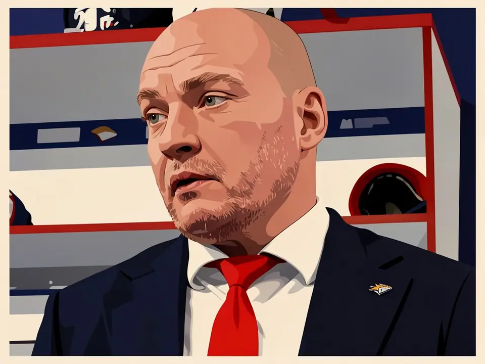 Coach Andrei Razin in a suit and red tie in front of the Metallurg bench