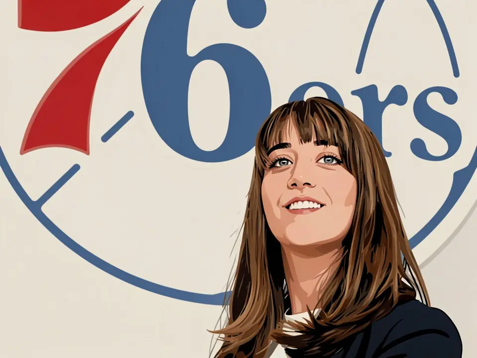 Ariana Andonyan im dunklen Anzug vor dem 76ers-Logo