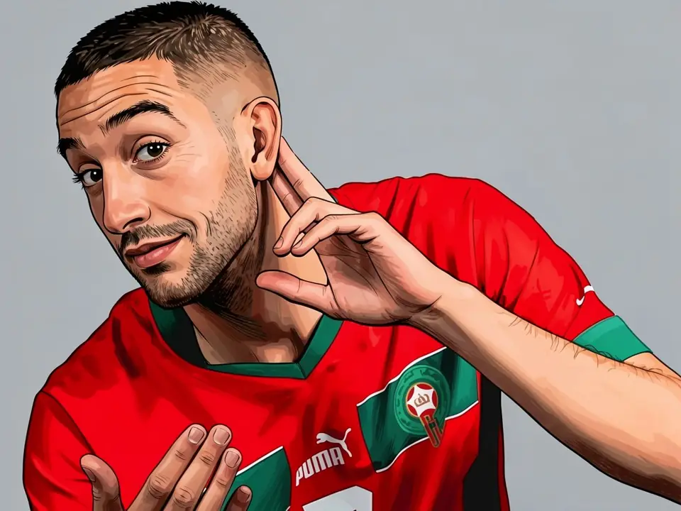 Hakim Ziyech in Morocco's red kit makes a listening gesture with his hands