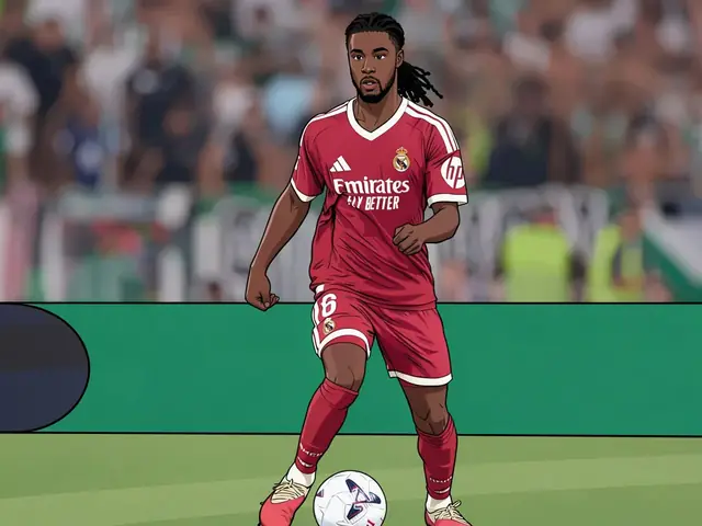 Real Madrid midfielder Eduardo Camavinga in a red kit dribbles the ball on the pitch during a match.