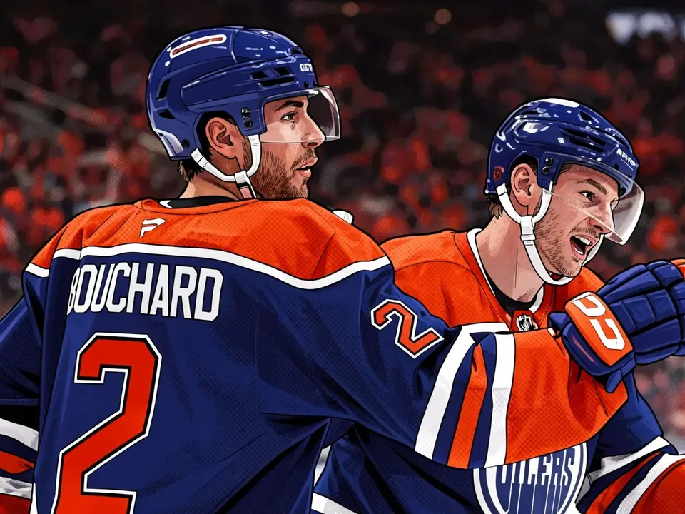 Edmonton Oilers player Bouchard in blue kit celebrates a goal with a teammate on the ice