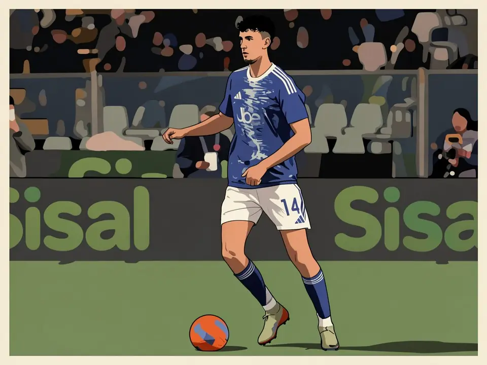 Como defender Jacobo Ramón dribbles the ball on the pitch in the blue team kit.