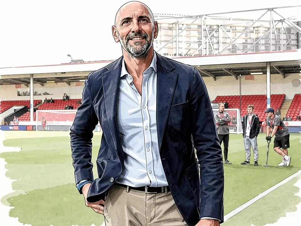 Monchi on the pitch in a navy blazer and light blue shirt
