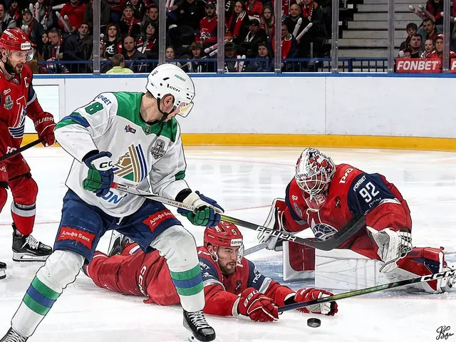 Lokomotiv players and an opponent in action near the goal during a KHL match