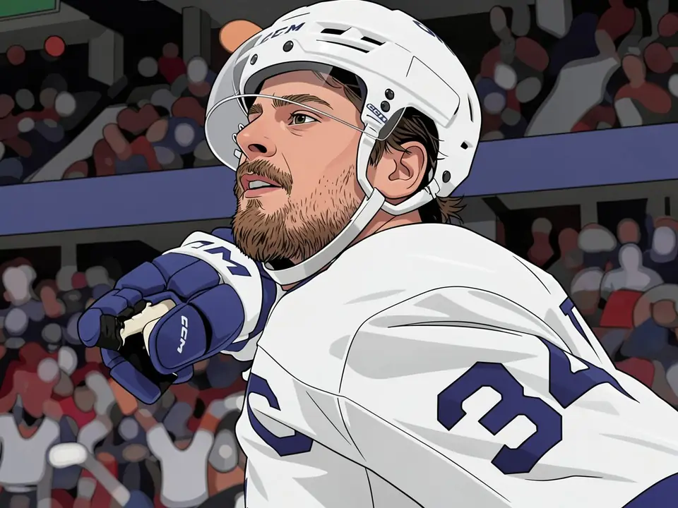 Auston Matthews in a white Toronto Maple Leafs jersey points forward during a game