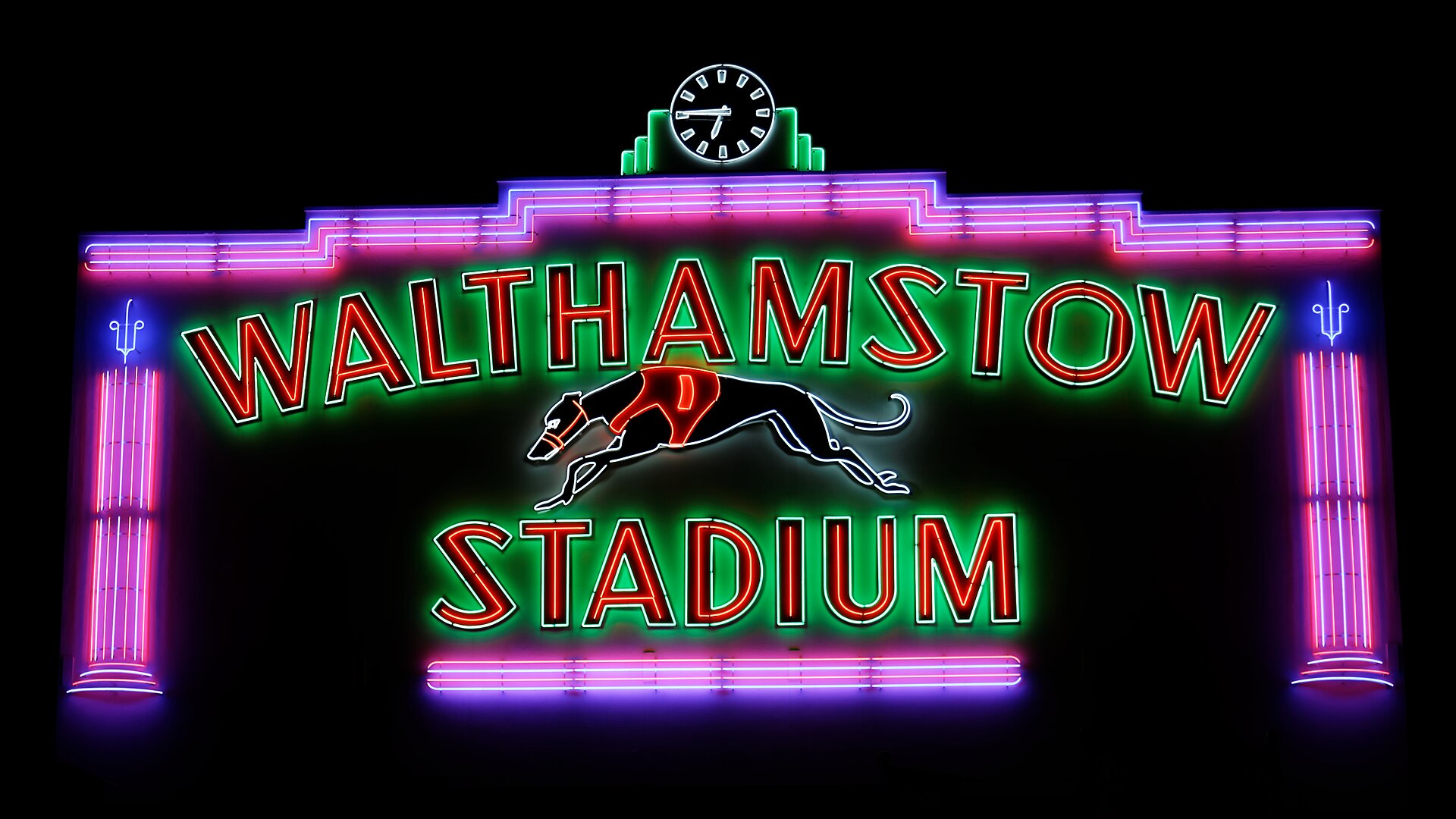 The February 2016 newly refurbished neon light frontage of the old Walthamstow Greyhound Stadium in the Borough of Waltham Forest , London. England. The greyhound stadium was closed in 2008, and has been redeveloped as 'Stadium Place,' and will include residential housing, markets and malls . The fr
