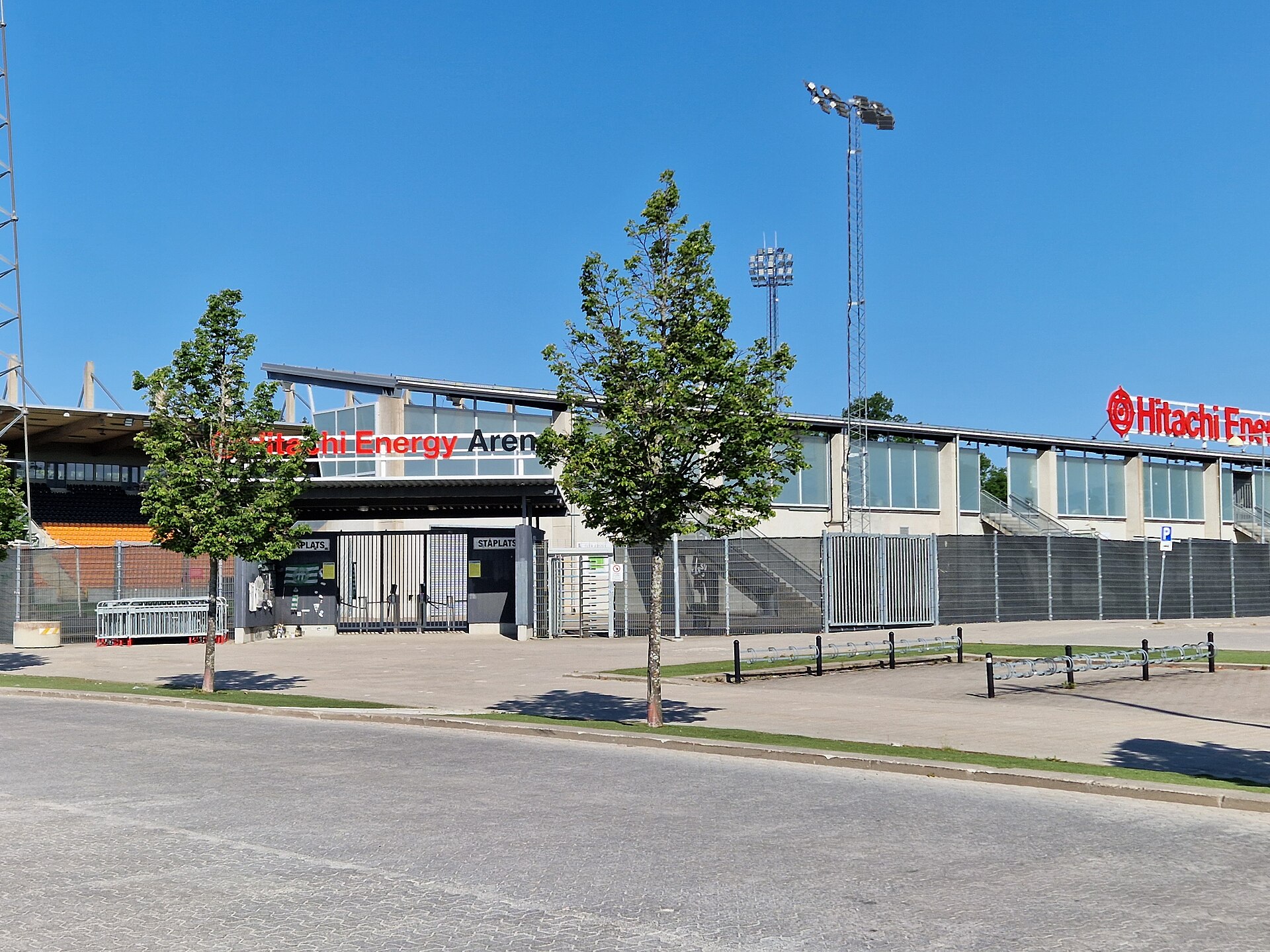 Hitachi Energy Arena (for football), located on the Rocklunda sports area in Västerås, Sweden. The southern entrance. It can hold an audience of 7 000 of which 4 126 can be seated. It has heated artificial turf. It started 2008, recently renamed to Hitachi Energy Arena in 2023.
