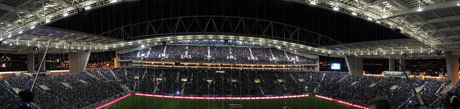 Estadio do Dragao on opening night (note: the cranes and suspended ropes were used by acrobats that night). Author: Joao Castro.