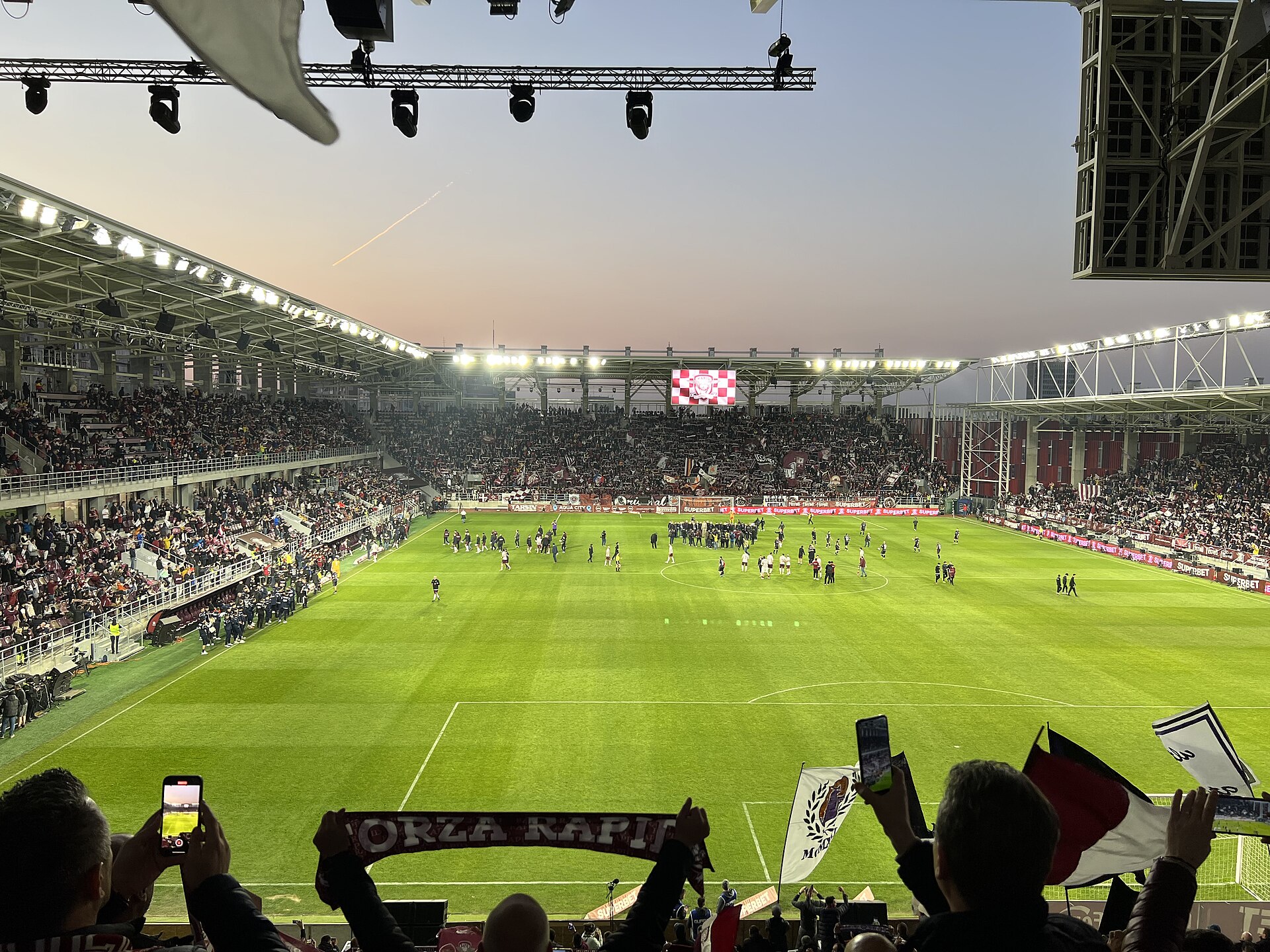 Rapid Arena in the evening of its inauguration day as seen from the South Stand, 26 March 2022.