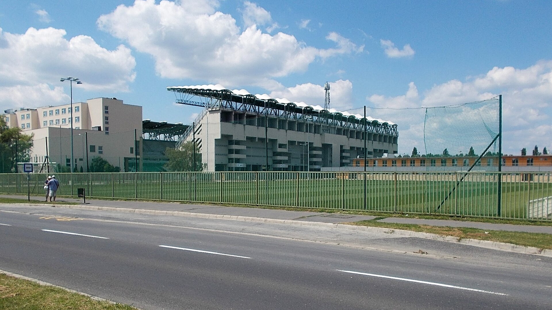 : 'Állatkert, műjégpálya' bus stop (8 and 8A lines), ETO Park stadium (2008) end east wing of the ETO Park Hotel. - Nagysándor József street, Gyárváros neighborhood, Győr , Győr-Moson-Sopron County , Hungary .