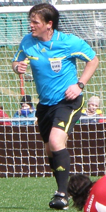 Petur Reinert is a Faroese international FIFA referee. This photo is from a domestic match in Trongisvágur, Faroe Islands at the first match on the new stadium Við Stóra, which is the home field of TB Tvøroyri. Petur Reinert has been a referee in around 370 football matches (in the Faroe Islands and