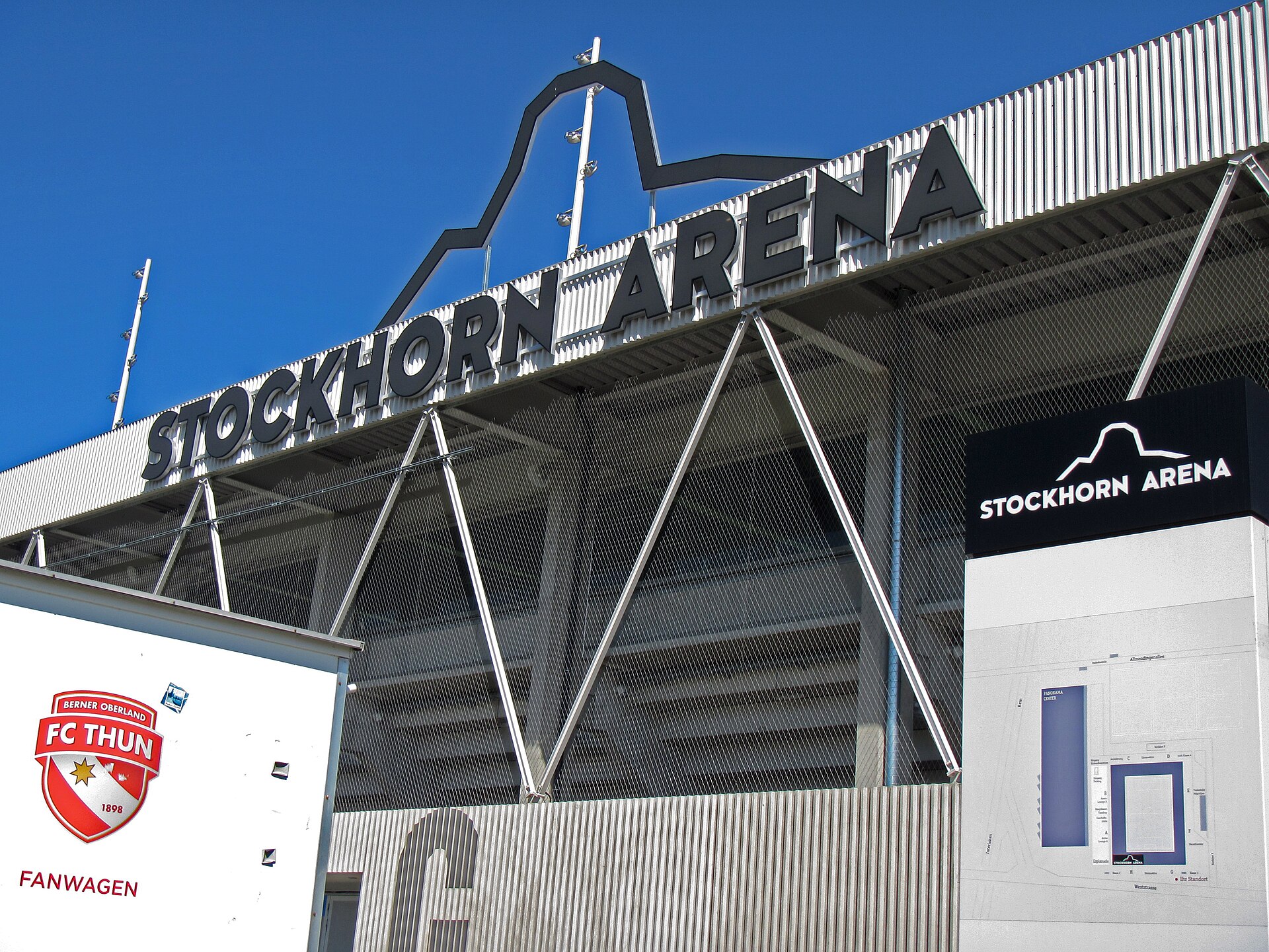 External view of the Stockhorn Arena (home of FC Thun): with logo, fanwaggon and information panel.