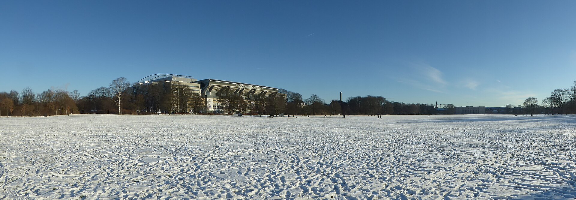 Fælledparken in Østerbro in Copenhagen with snow. At the left the national soccer stadium Parken.