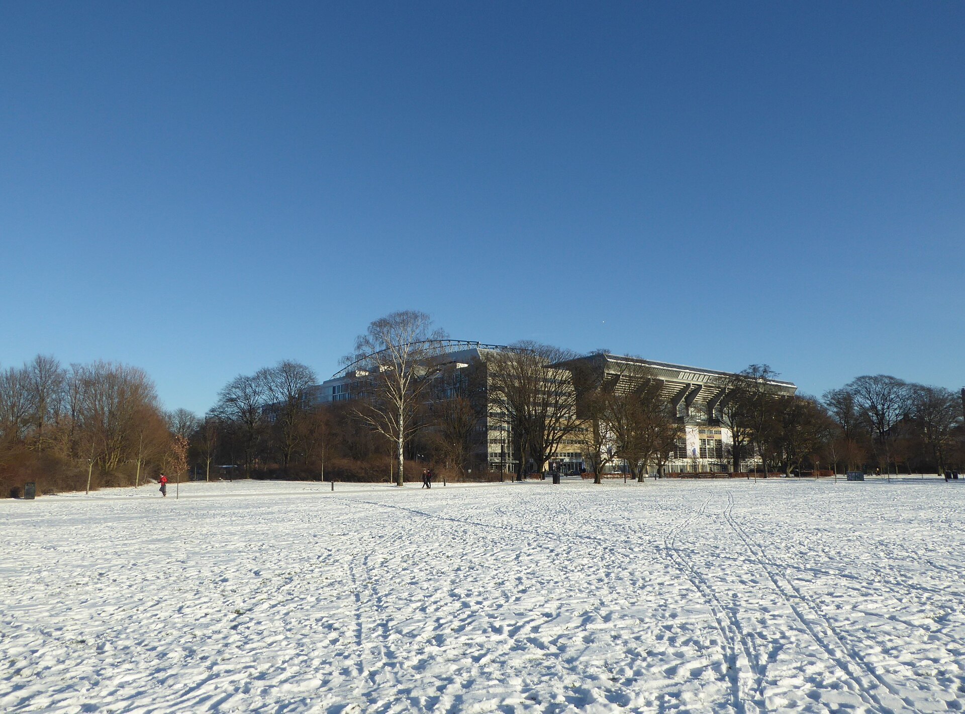 Fælledparken in Østerbro in Copenhagen with snow. The national soccer stadium Parken.