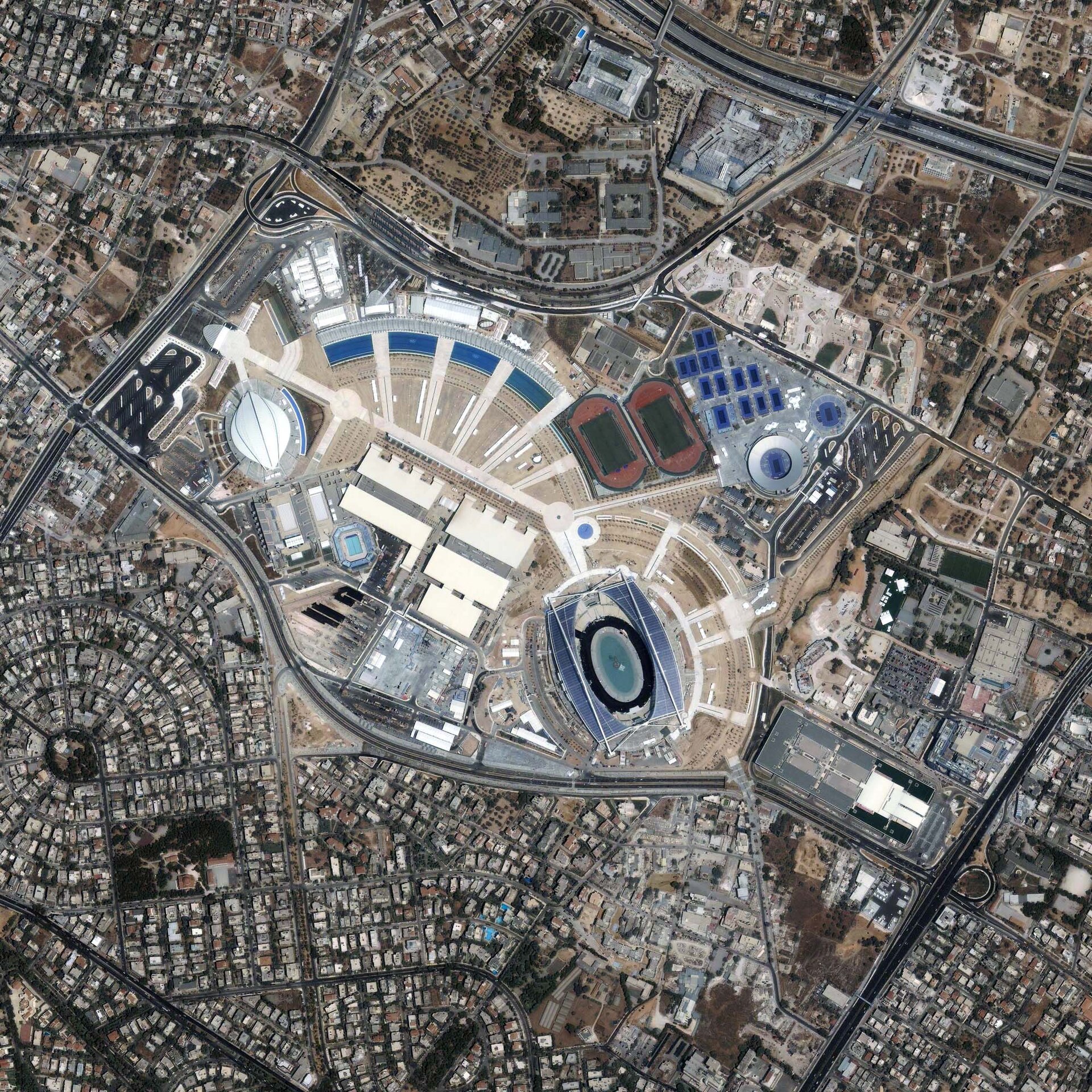 This high-resolution image shows the Athens Olympic Sports Complex. Acquired on June 24, 2004, by Space Imaging’s IKONOS satellite, the scene shows the complex in stunning detail, including the Olympic Stadium (home of the opening and closing ceremonies), the Olympic Aquatic Center, Olympic Indoor H