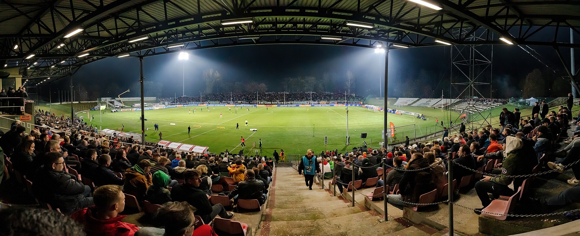 Association football match between Zagłębie Sosnowiec and Wisła Kraków at Stadion Ludowy in Sosnowiec , Silesian Voivodeship , Poland , on 28 October 2022. The panoramic photograph shows a night view from the covered stand during the official farewell to Stadion Ludowy as Zagłębie Sosnowiec’s match 
