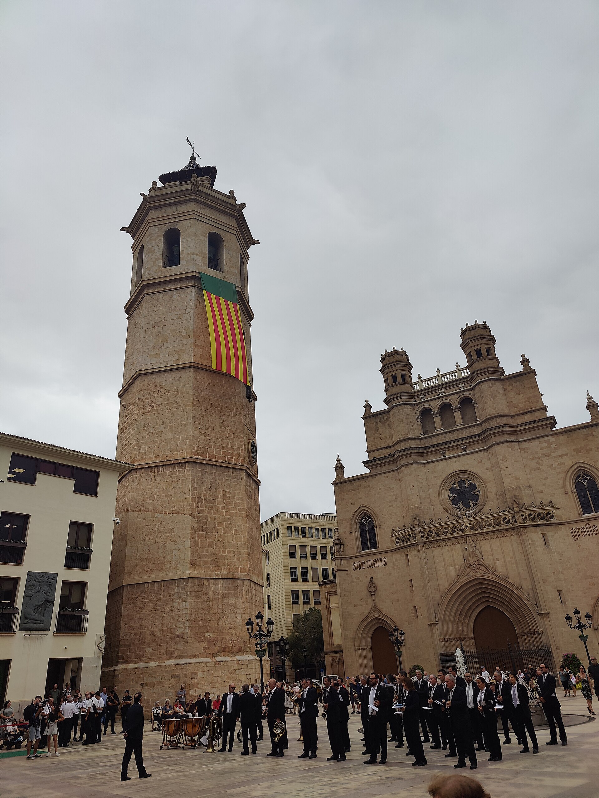 Municipal marching band playuing some music and the Fadrí decorated with the local flag the September 8th 2023 to commemorate the 772 anniversary of the city of Castelló de la Plana, Valencian Community, Spain.