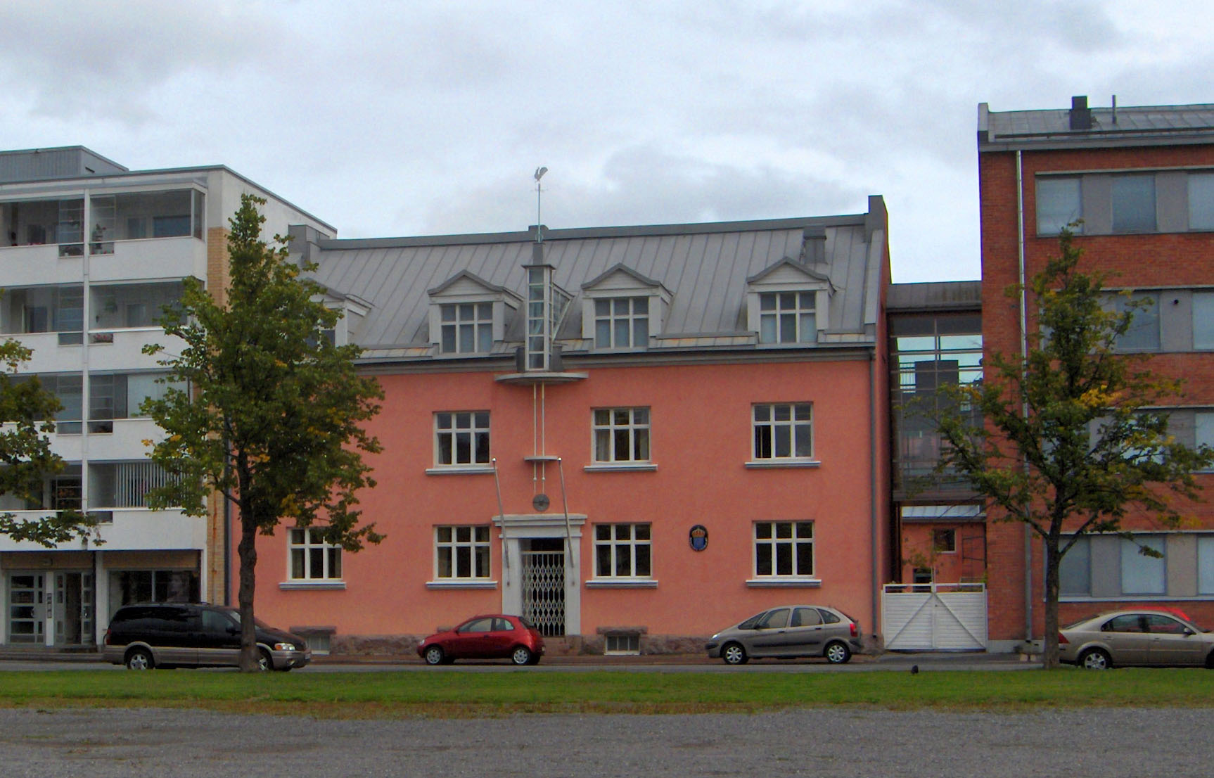 Björneborgs svenska samskola, the Swedish School of the city of Pori, Finland. The pink building in the photo is the oldest part of the school, the red brick building the newer part.