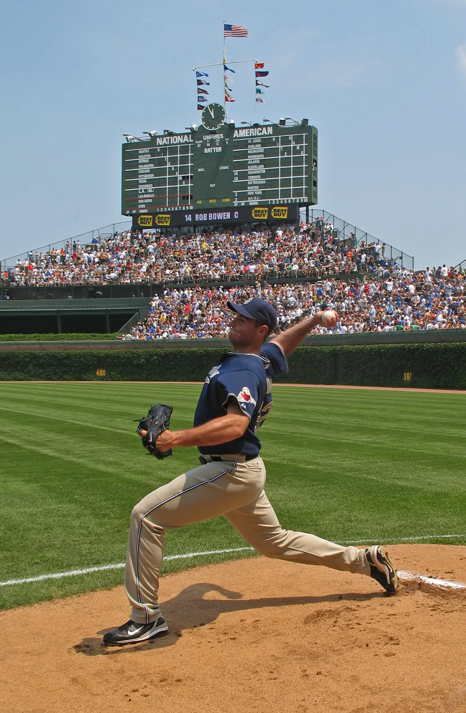 Chris Young with the San Diego Padres winding up for a four-seam fastball in the bullpen while warming up. This image was taken on the day that starting pitcher Young (pictured) and Derek Lee had a bench clearing incident. The picture captures a grip for a type of fastball known as a four-seam fastb
