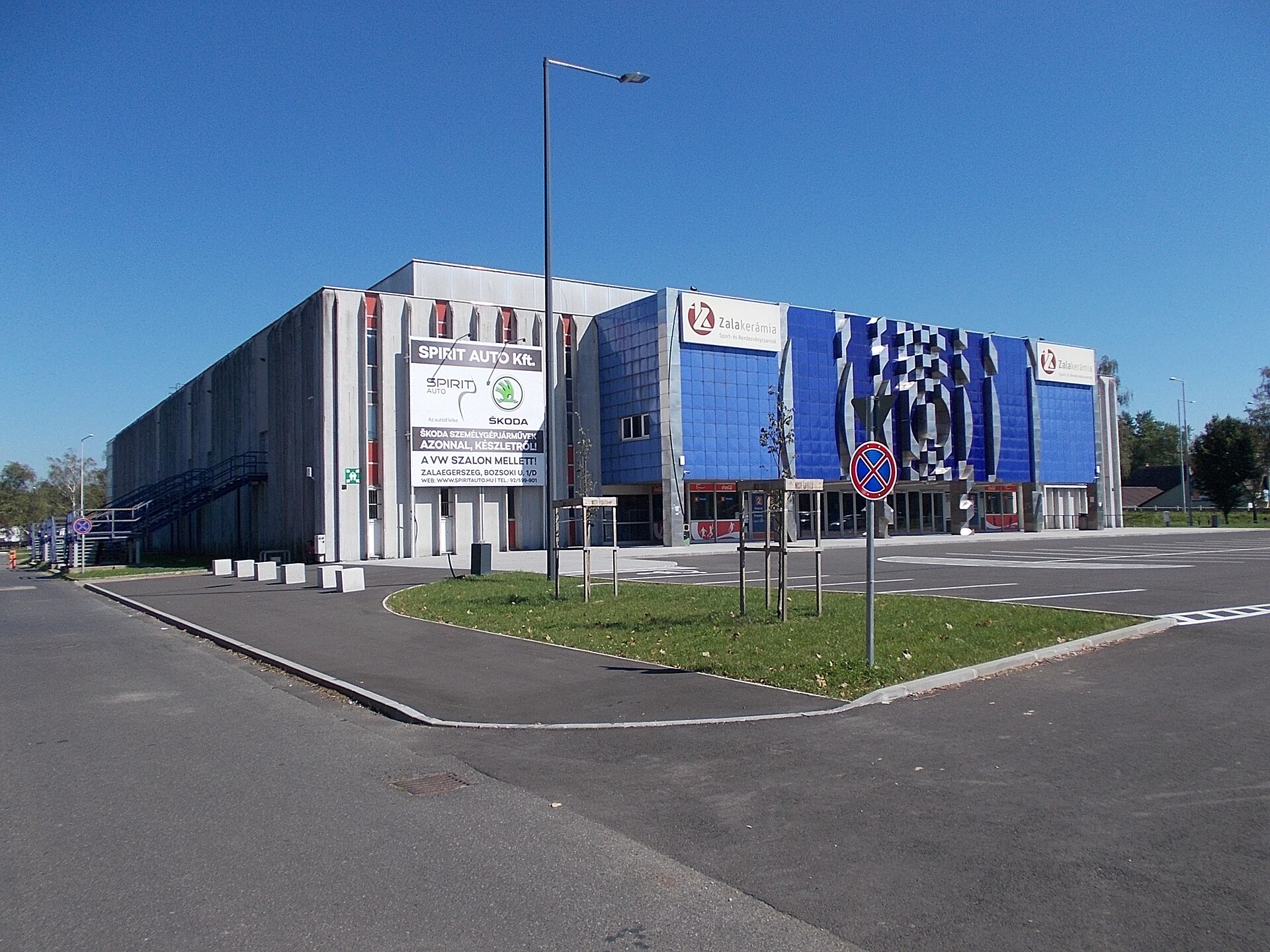 : Zalakerámia Sports and Event Hall. Facade ornament by János Blaski (painter), György Segesdi (1980 modern relief, non-figurative, steel, enamel and other material) The circular shapes display the "target"- 3 Stadion Street, Zalaegerszeg , Zala County , Hungary .