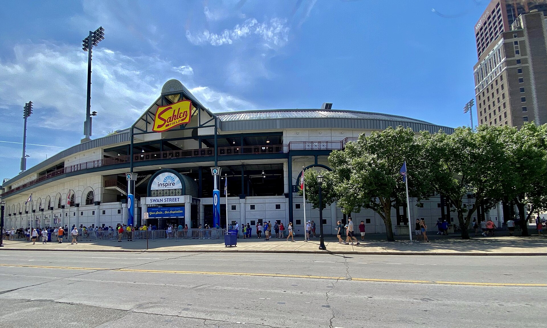 As seen from across Swan Street, a bevy of fans line up at the gates of Sahlen Field in downtown Buffalo, New York ahead of an August 2022 Sunday afternoon game against the visiting Columbus Clippers.