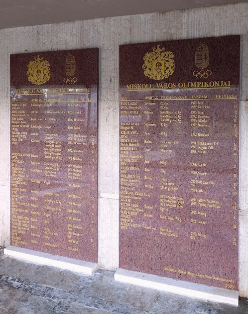 Memorial plaque of Miskolc Olympians next to the main entrance of the Miskolc Sports Hall.