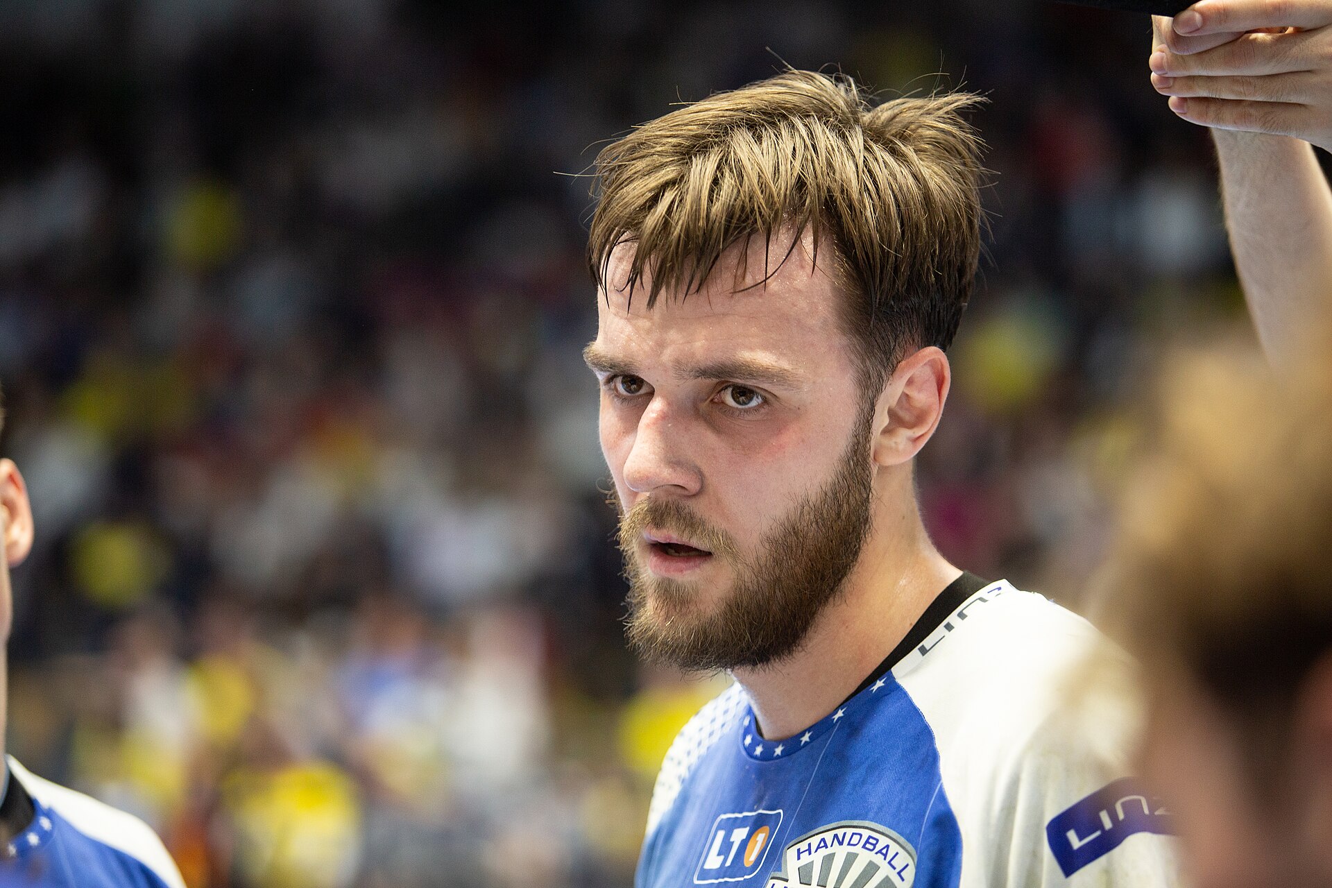 Handball player Andrej Klimawez during a timout.