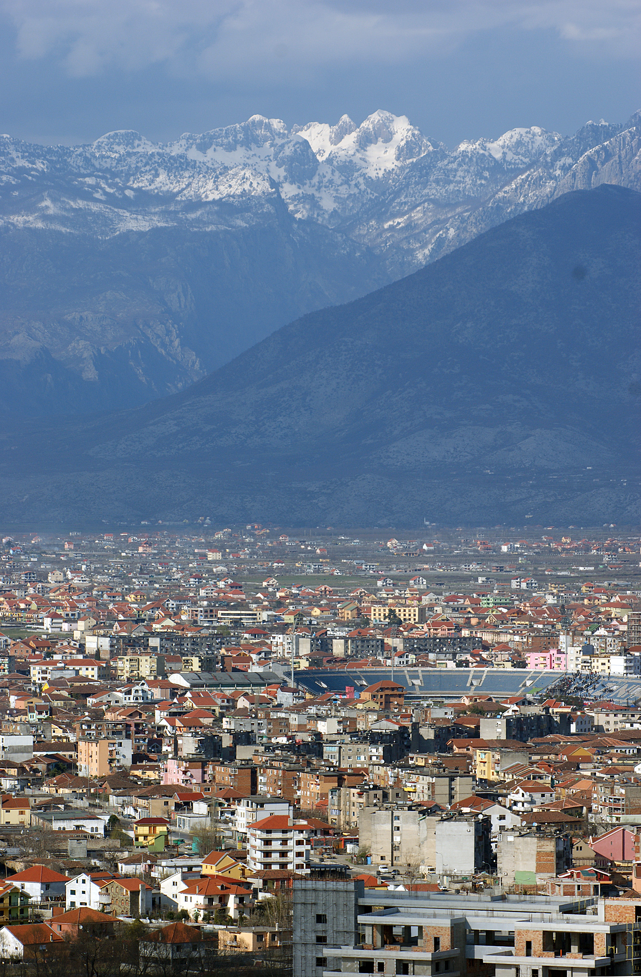 Albanian Alps seen from Shkodra. The city in front, Rjoll valley in the background.