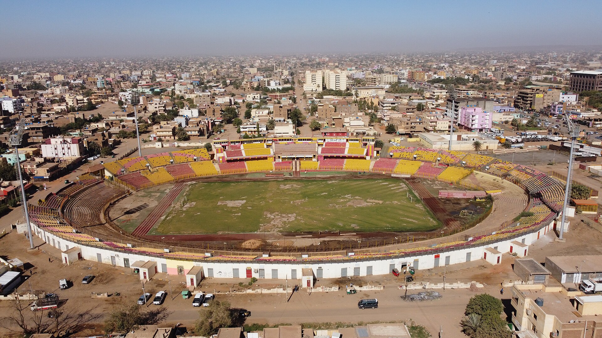 Al-Marekh Stadium, Omdurman, Sudan 1964. Designed by Abdel-Moneim Mustafa. The main concept was inspired from the use of a cost-effective method to construct a stadium that represents a landmark. The playing field level is – 4 meters while the highest level is 7 meters from the ground floor. So the