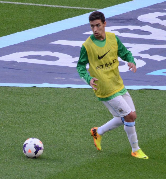 Jesús Navas warming-up for Manchester City F.C. before first game of the 2013/14 season against Newcastle United on 19 August 2013.