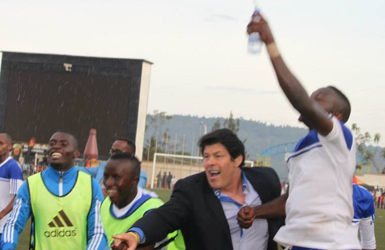 Luc Eymael celebrating with Rayon Sports players after a win against APR Club.; 23 March 2014 ; Stade Régional Nyamirambo, Kigali, Rwanda