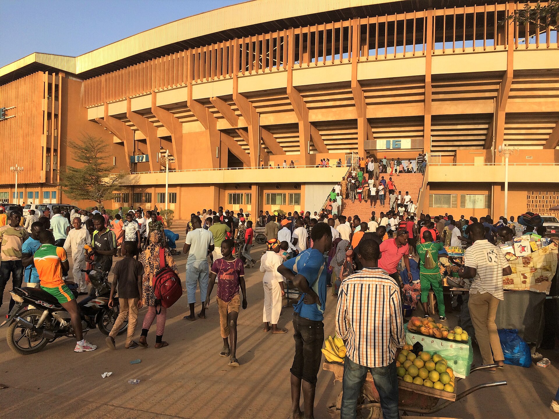 People leaving the General Seyni Kountché Stadium in Niamey after a soccer match (in Niger).