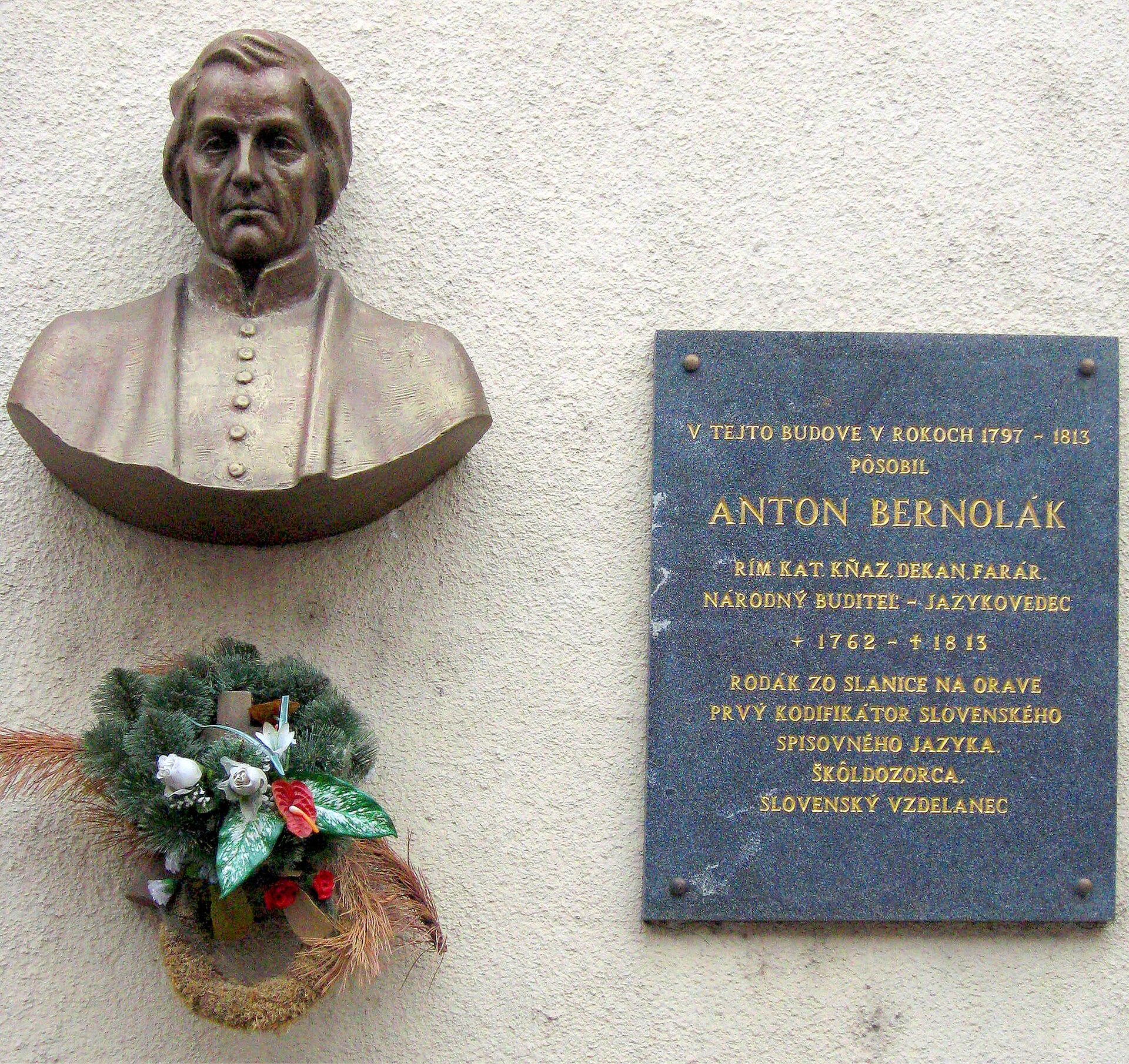 Bust and memorial plaque of Anton Bernolák on Marianum building in Nové Zámky