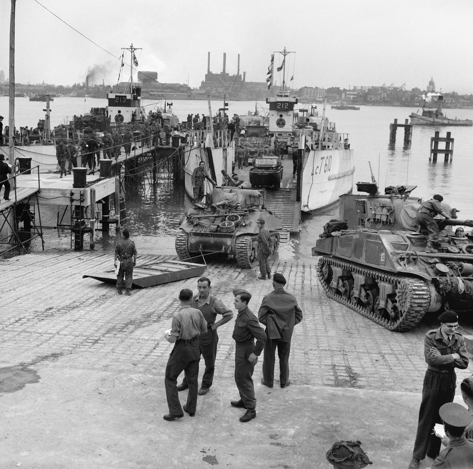 Allied Preparations For D-day Sherman tanks of the 13th/18th Hussars, 27th Armoured Brigade, embarking onto LCT-610 at Gosport, 3 June 1944.The 'three triangles' formation sign of 3rd Infantry Division can be seen on the wheelhouse of the landing craft.