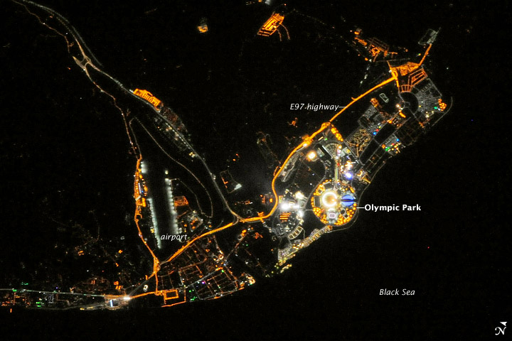 Three months after bearing the Olympic torch outside their orbiting home, the astronauts and cosmonauts on the International Space Station (ISS) got to look down on that flame from above. On the evening of February 10, 2014, an Expedition 38 crew member on the ISS captured this digital photograph of