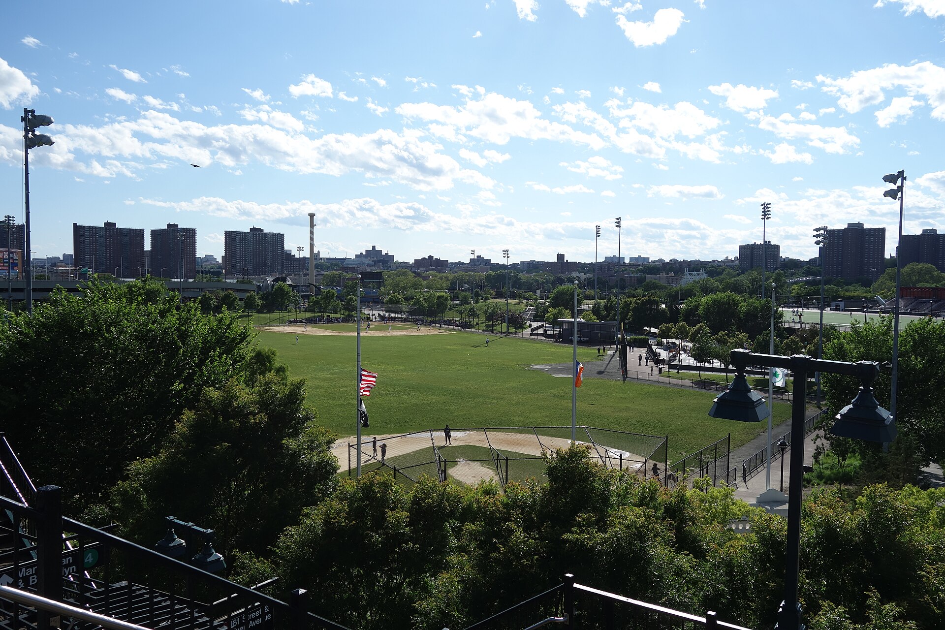 Looking southwest from the Manhattan-bound platform of the 161st Street – Yankee Stadium IRT station at the fields of Heritage Field (since renamed Elston Gene Howard Field), above River Avenue and 161st Street in Highbridge / Concourse, Bronx. This was the site of the original Yankee Stadium.