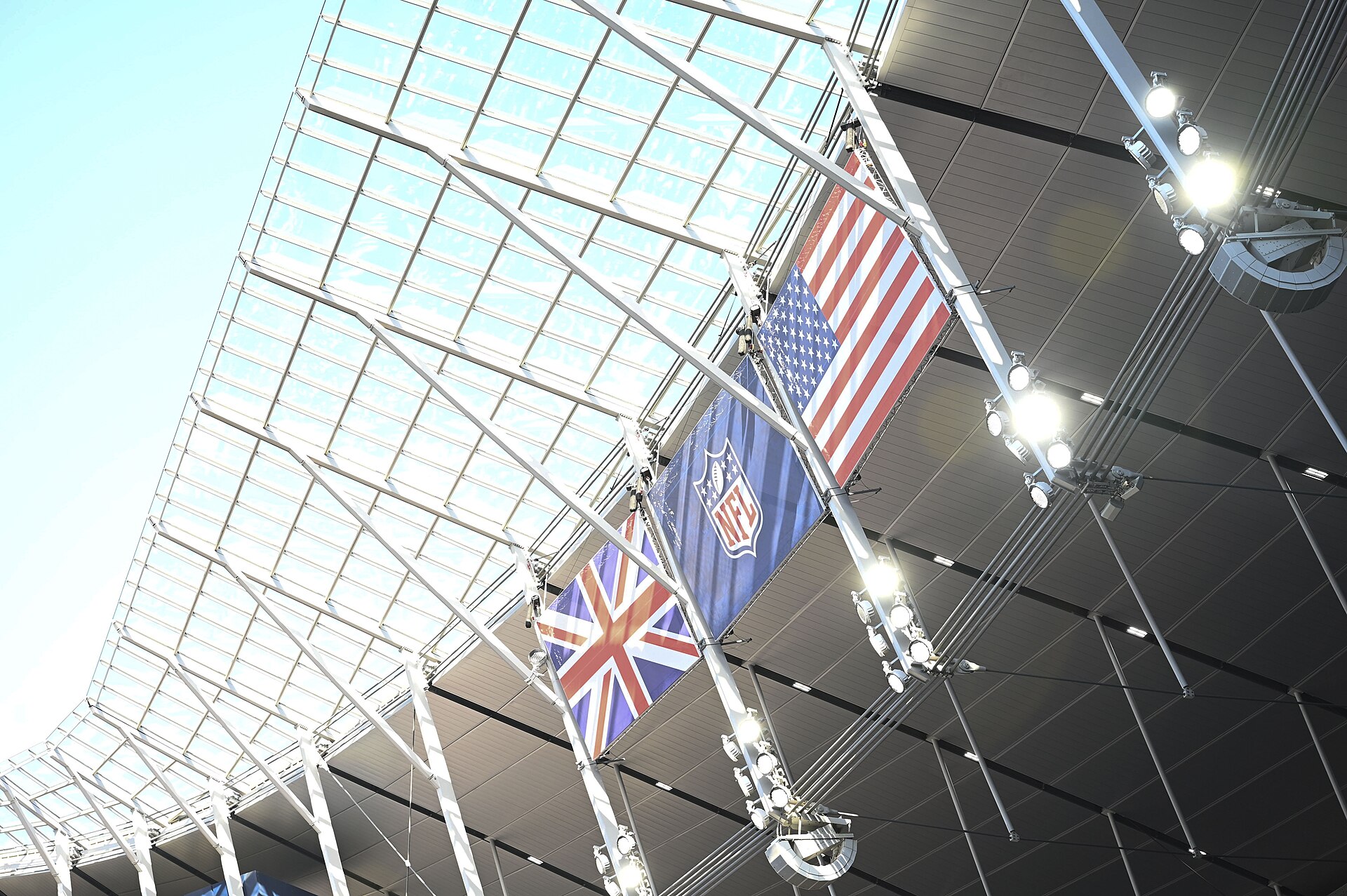 The British and U.S. flag hangs above the National Football League’s Baltimore Ravens vs. Tennessee Titans arena during a pre-game ceremony at Tottenham Hotspur Stadium, in London, England, Oct. 15, 2023. The Ravens defeated the Titans 24-16. (U.S. Air Force photo by Airman 1st Class Katie Mullikin)