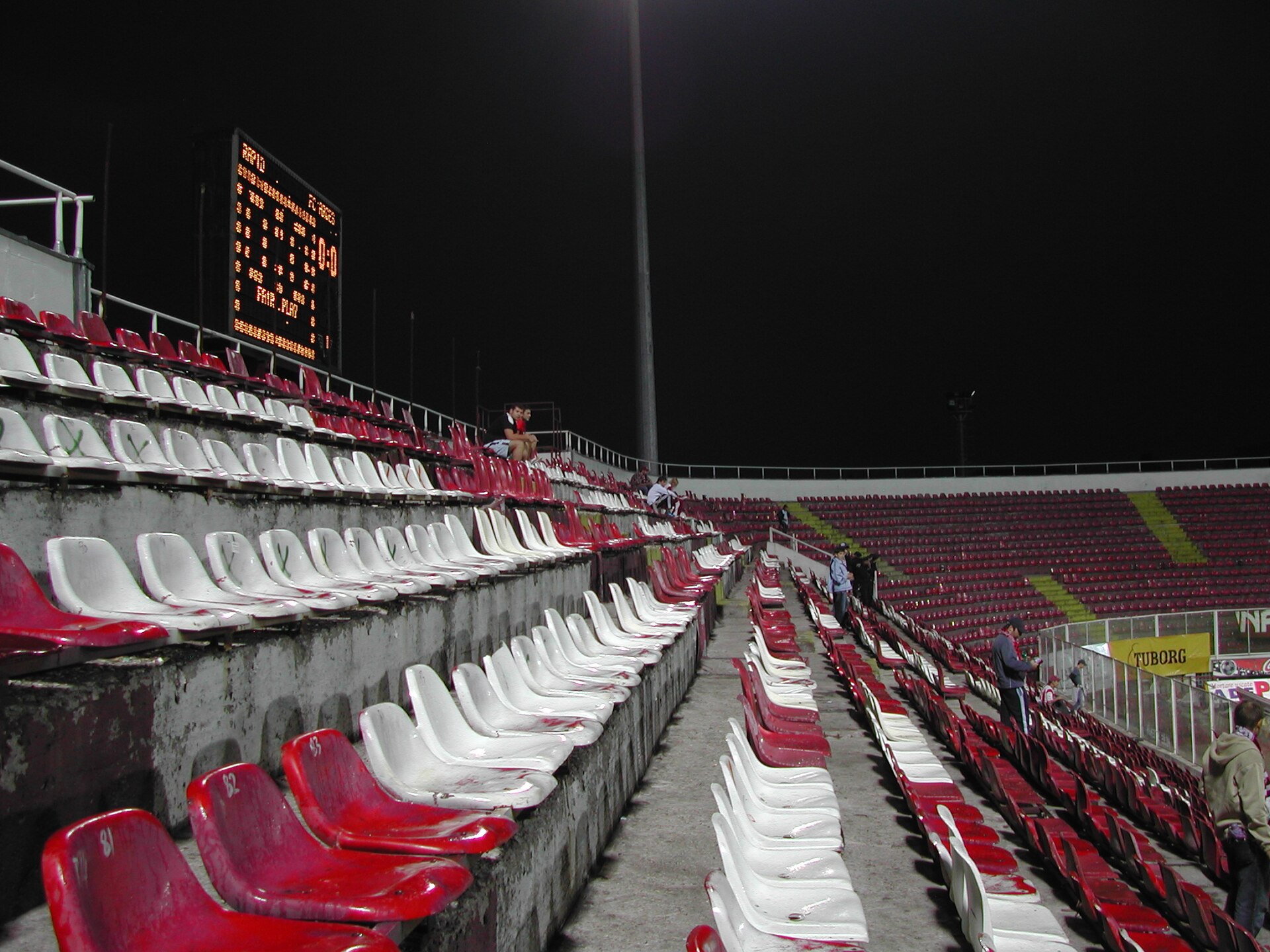 This picture shows some seats an the scoreboard of the football ground Giuleşti-Valentin Stănescu. This ground is located in Bucharest, Romania and is the home ground of Rapid Bucureşti.