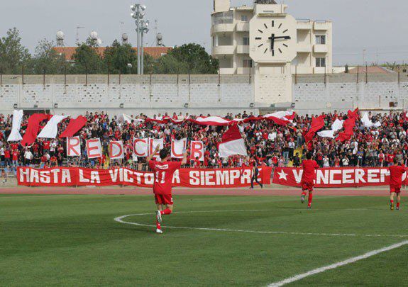 Nea Salamina Famagusta Fans at Makario Stadium , in the last game of 2008–09 Cypriot Second Division , winning Olympiakos Nicosia and the promotion to Cypriot First Division , leaving the opponent in the Cypriot Second Division .