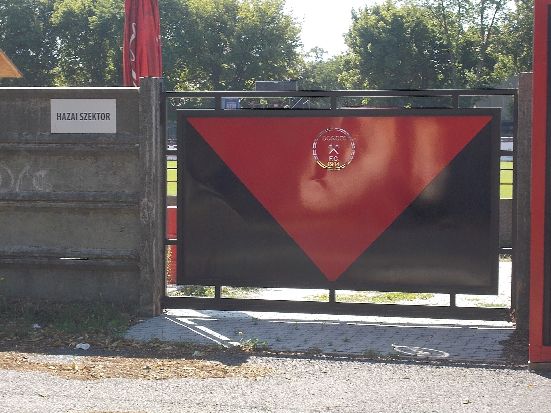 : Buzánszky Jenő Stadion , home sector, gate . - Köztársaság Street, Dorog , Komárom-Esztergom County , Hungary .