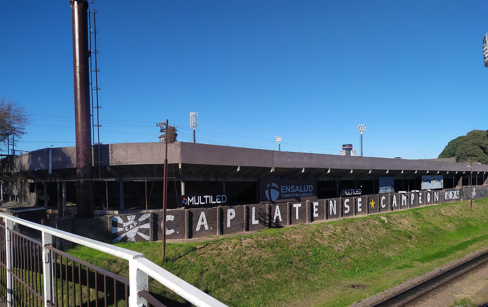 view of C.A. Platense Stadium (north stands) from the pedestrian bridge over the Belgrano Norte Line tracks.