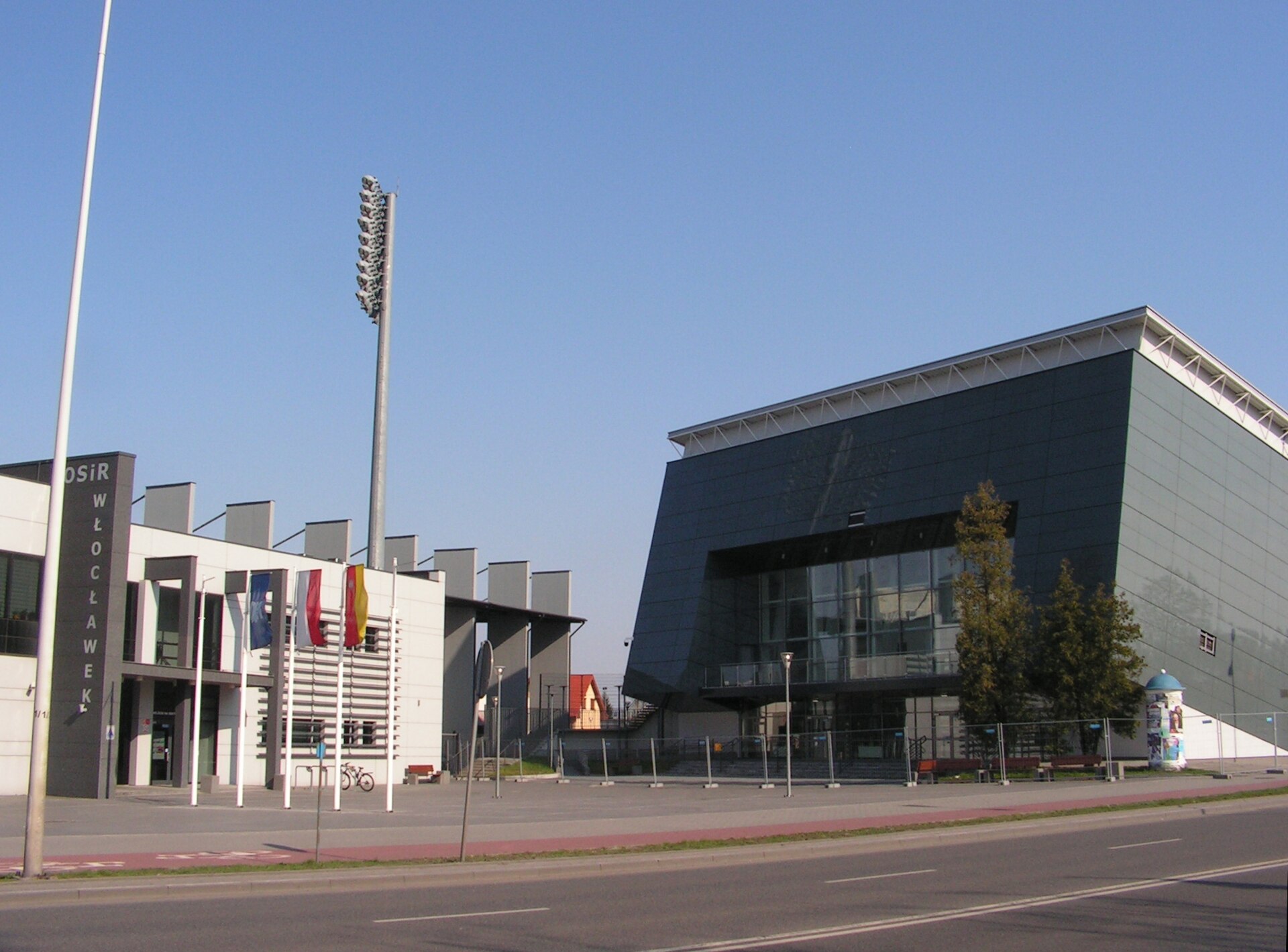 Sports objects at Chopin Avenue in Włocławek. On the left side there is a OSiR (Ośrodek Sportu i Rekreacji - Sport and Recreation Centre) football-athletics stadium, rebuilt from 2011 to 2014 year. On the right side there is a OSiR Hall, rebuilt from 2017 to 2018 year.