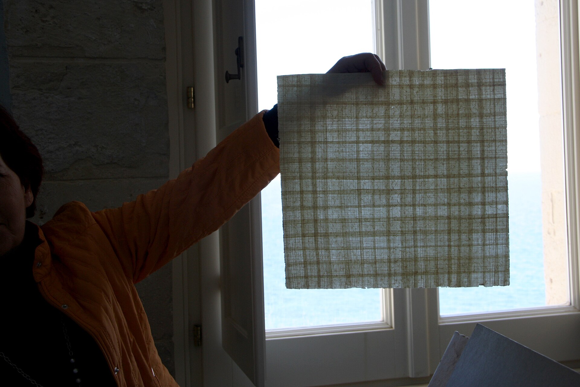 The director of the Papyrus museum in Syracuse , Italy, personally demonstrates the method used in ancient times to create papyrus paper (the name "paper" itself comes from "papyrus"). In the set of images it is shown how the young papyrus trunk is cut into stripes, which will stick together thanks