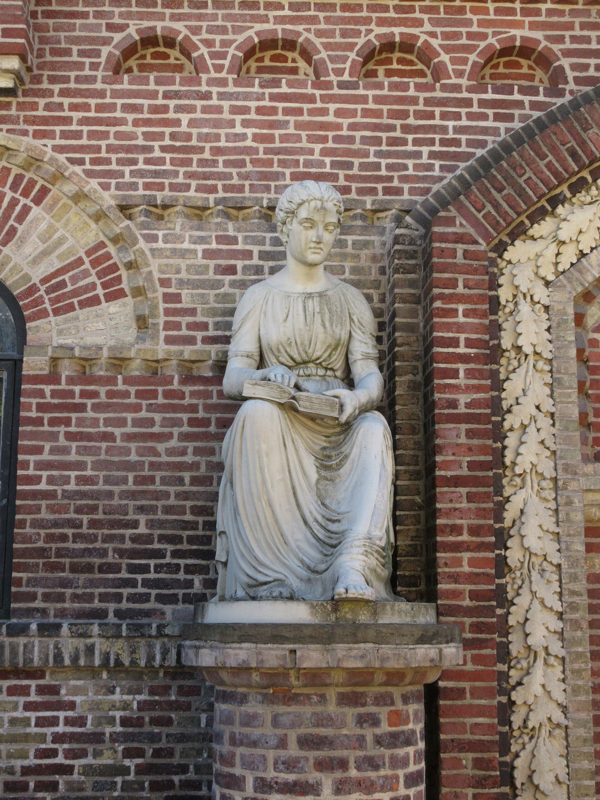 The statue A Blind Girl at the main entrance of the former Institute for the Blind in Kristianiagade in Copenhagen, Denmark
